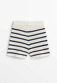 Crocheted shorts with a white base and navy stripes, featuring a textured fabric and an elastic waistband.