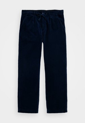 Calças de cordura azul marinho com cintura elástica, apresentando bolsos laterais e um design de perna reta. Textura suave com nervuras verticais.