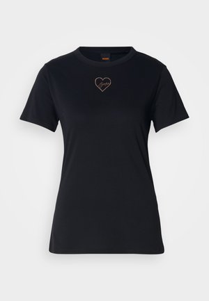 Maglietta in cotone nera con collo a giro, maniche corte e un logo a forma di cuore ricamato in oro rosa sul petto.