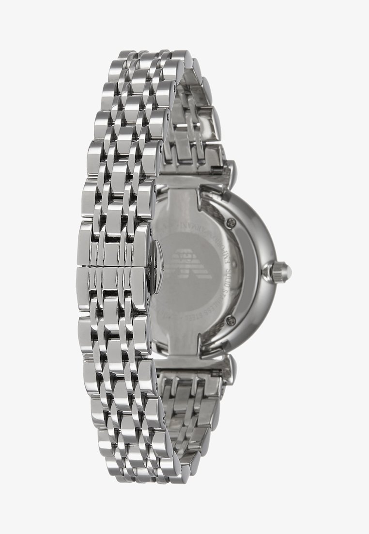 Silberne Metalluhr mit einem Gliederarmband und rundem Gehäuse. Die Rückseite zeigt eine glatte Oberfläche mit dezent eingravierten Markendetails.