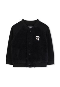 Giubbotto bomber nero con una parte anteriore in pelliccia nera morbida, maniche a maglia e colletto rotondo. Presenta un piccolo logo a cartone animato sul petto sinistro.