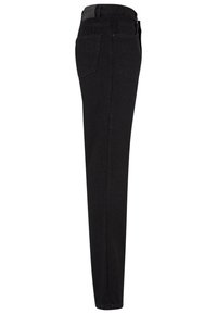 Jean noir slim-fit vu de côté avec une poche arrière visible et des passants de ceinture à la taille.