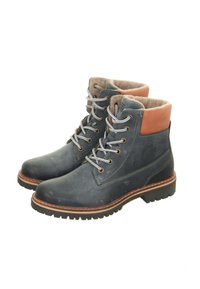 Leather ankle boots in dark blue with a tan leather accent, grey laces, textured lining, and a black rubber sole with a rugged tread.