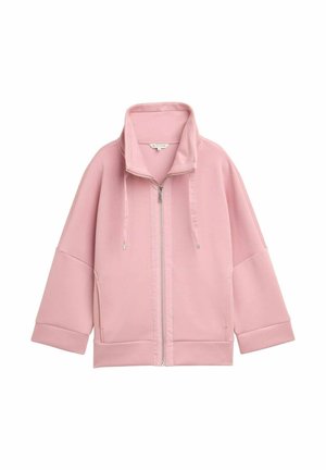 Veste zippée rose clair avec col haut, cordons de serrage, épaules tombantes et manches larges sur un fond blanc.