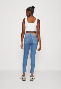 Levi's® 721™ HIGH RISE SKINNY SPLIT HEM - Vaqueros pitillo - heart goes boom