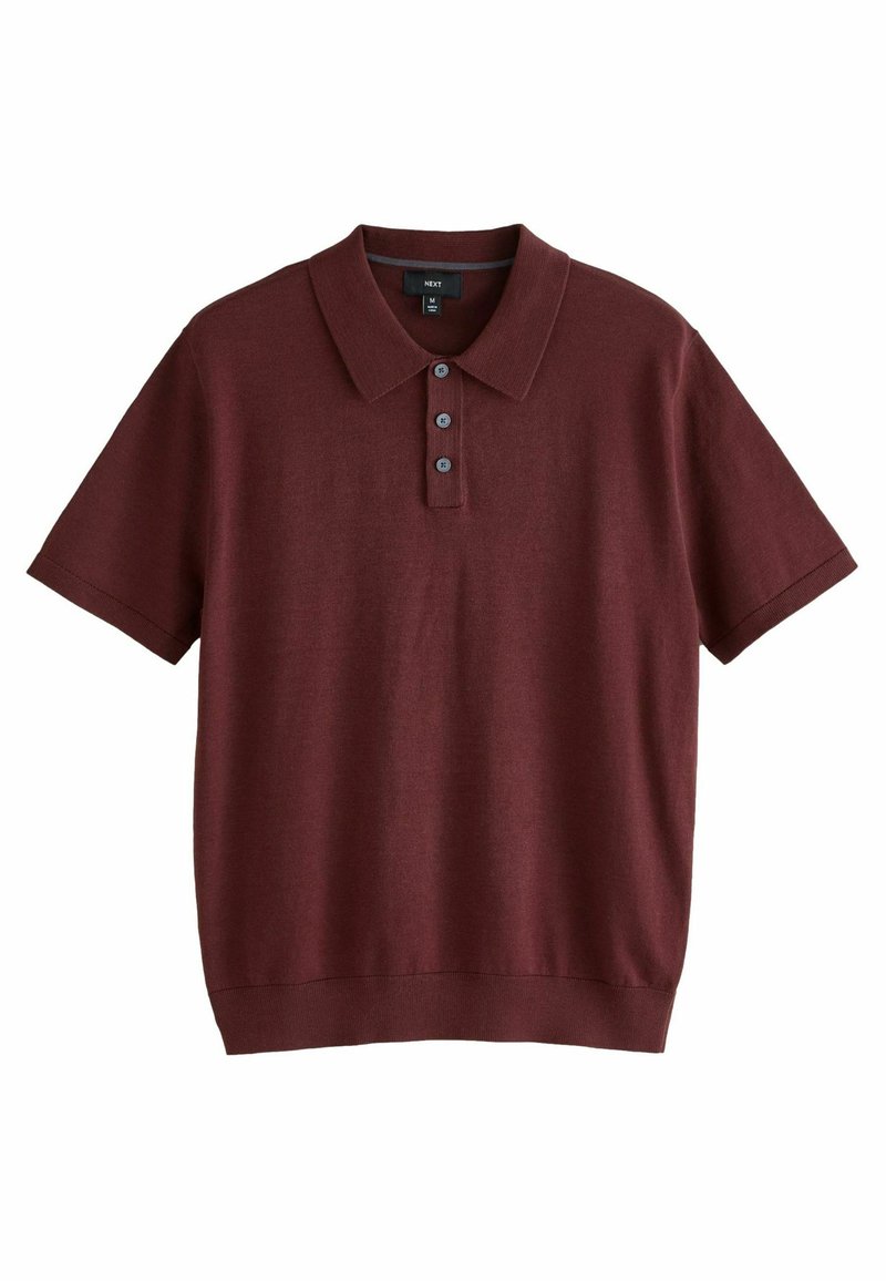 Polo shirt bordeaux a maniche corte realizzato in tessuto morbido, con colletto classico, patta a tre bottoni e orli a costine sulle maniche.