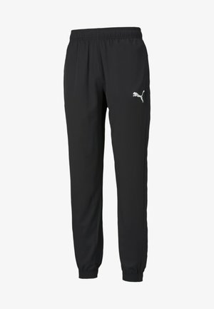 Zwarte sportbroek met elastische tailleband en boorden, voorzien van een wit Puma-logo op de bovenkant van de linker dij.
