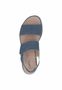 Mėlyna zomšinė šlepetė su dviem reguliuojamais dirželiais, atvira nosimi ir paminkštintu vidpadžiu. Papuošta dekoratyviniu siuvinėjimu ir kaučiuko padas.