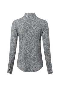 Long-sleeve shirt in blue with a floral print. Collared design with button details. Soft fabric, curved hem, and textured appearance.