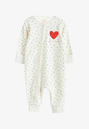 Baltas kūdikių kombinezonas su mažais juodais širdelių raštais, raudona širdies grafika, užtrauktuku ir minkšta dryžuota tekstūra. Rankogaliai vientisos baltos spalvos.