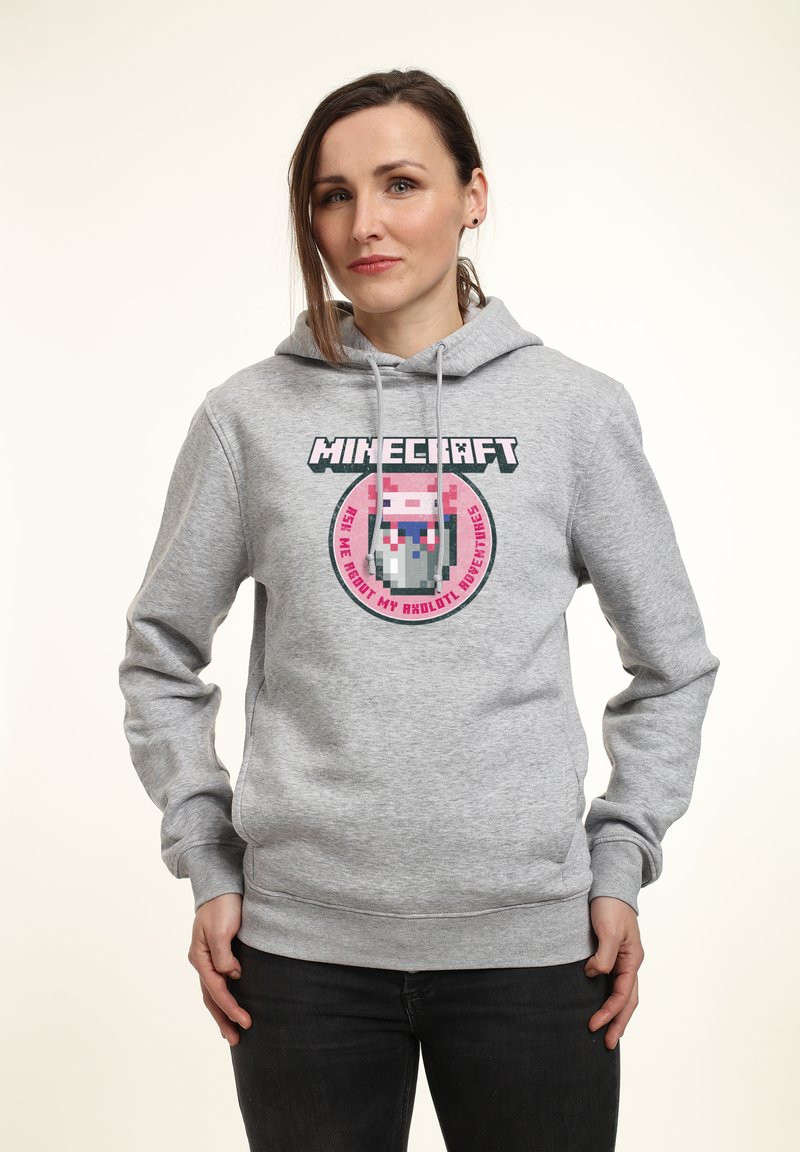 Felpa grigia con cappuccio e lacci, con logo di Minecraft e design di personaggi pixelizzati in rosa e blu, vestibilità standard con polsini a costine.