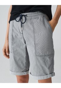 Gray striped shorts made from lightweight fabric. Features an elastic waistband with a drawstring, front pockets, and rolled cuffs.