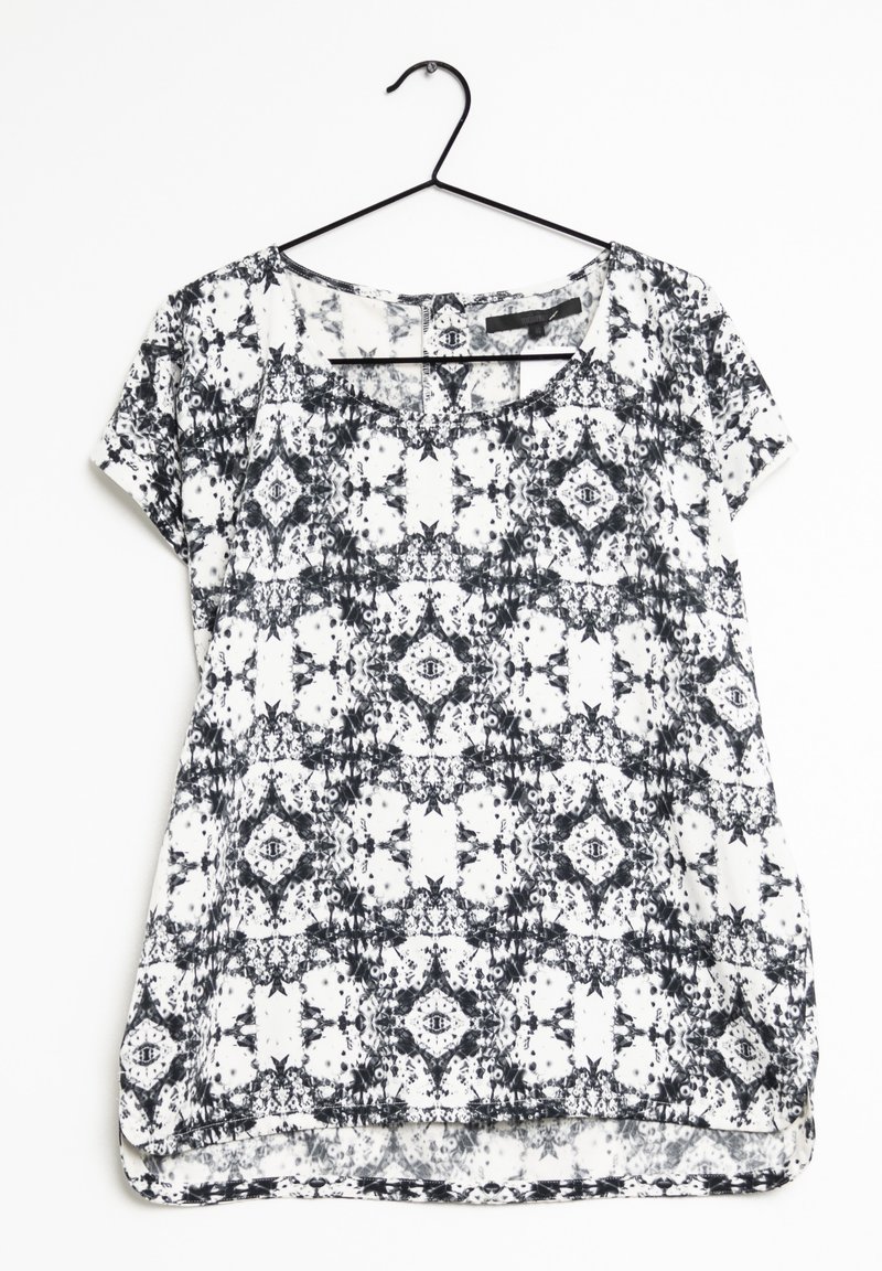 Sort-hvid mønstrede kortærmede bluse med løs pasform, rund halsudskæring og en let buet kant. Letvægtsstof med en glat tekstur.