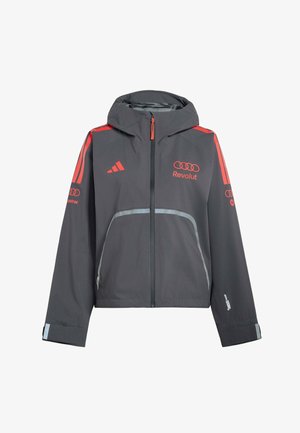 Mørkegrå hættejakke med røde logoer og striber, lynlås foran samt reflekterende detaljer på lommer og manchetter.