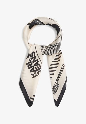Jedwabny szal w kolorze kremowym z czarnym graficznym napisem "KARL LAGERFELD JEANS" oraz abstrakcyjnymi wzorami w kropki i paski, zawiązany luźnym supełkiem.