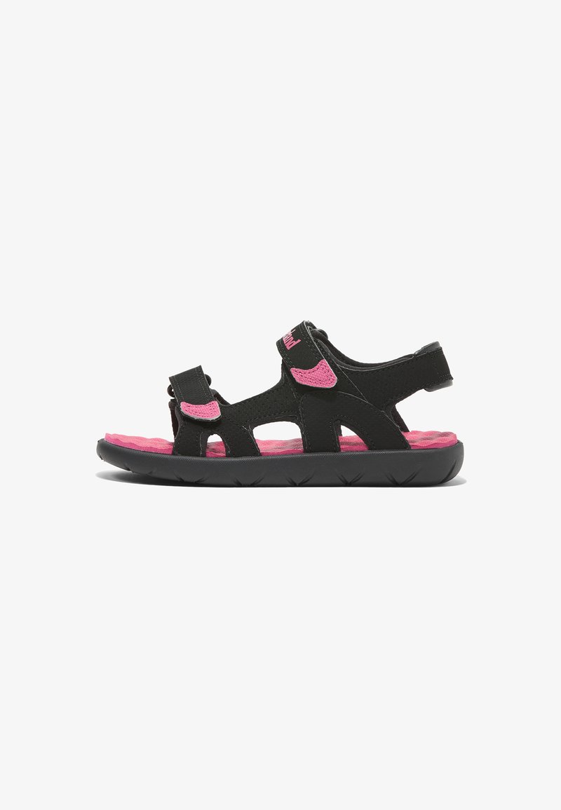 Black sandal with pink accents, featuring adjustable straps, open design, textured sole, and a cushioned insole for comfort.
