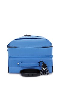 Blue backpack with a textured exterior, featuring a top zipper, side handle, and a black hardware accent. Includes a hanging charm.
