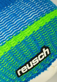 Knitted blue and green sports glove with textured pattern, featuring a white accent wave design and a black "reusch" logo tag.