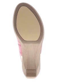 Shoe sole with a smooth, light beige rubber surface, featuring a subtle logo imprint. Slight curve at the toe area, sturdy construction.