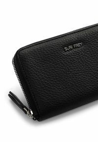 Black leather wallet with a textured surface, featuring a silver logo and a zip closure with a tassel pull tab.