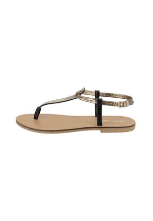 Sandalo piatto con fascia nera e dettaglio in oro metallizzato. Soletta beige con texture liscia e design minimalista. Fascetta regolabile per la caviglia.