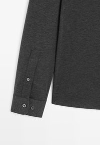 Dark gray long-sleeve shirt with a smooth texture, featuring a button-up cuff with two buttons and a classic shirt collar.