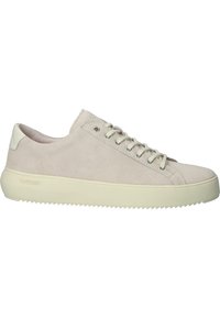 Beige suede sneakers with a round toe, flat rubber sole, and tonal laces. Features subtle branding on the heel and textured outer.