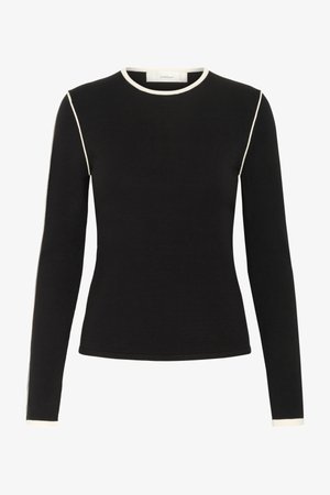 Black long-sleeve top with cream trim, round neck, fitted design, made from a soft stretch fabric, featuring contrasting side accents.