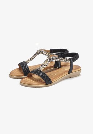 Schwarze geflochtene Sandalen mit einem strukturierten Riemendesign und einem gepolsterten Fußbett in Goldoptik. Mit verstellbaren Fesselriemen und einem niedrigen Absatz.