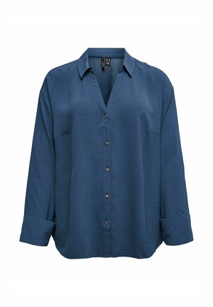 Dark blue button-up shirt with a textured surface, a v-neckline, gold buttons, and rolled sleeves. Features a single chest pocket.