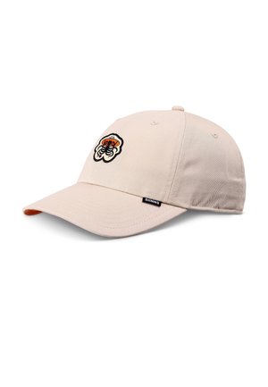Beige baseball cap with an embroidered orange and black graphic on front and a small "DJINNS" label on the side of the brim.