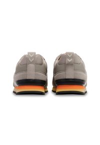 Gray athletic shoes with a textured suede and mesh upper, a contrasting orange and yellow midsole, and a pull tab at the back.