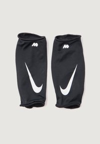 Mangas deportivas negras hechas de tela perforada con logotipos de Nike en blanco. Aberturas elásticas en ambos extremos para un ajuste seguro.