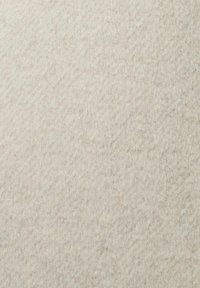 Tela de fieltro beige claro con una superficie suave y texturizada. El material parece denso y duradero, con un patrón sutil y uniforme en toda su extensión.