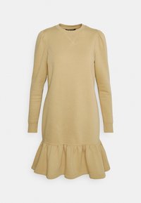 Světlý béžový šaty-svetr s dlouhými rukávy, kulatým výstřihem a volánkovým lemem. Vyrobeno z měkké látky s jemnými stehými detaily.