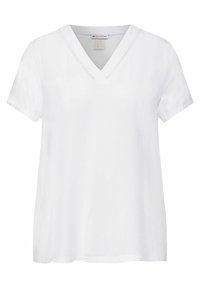 T-shirt blanc à manches courtes avec un col en V, présentant une texture lisse et un subtil détail de couture le long de l'encolure.