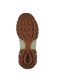 Shoe sole with a textured brown rubber design. Features a central groove and a red accent. Contains a pattern of triangular shapes for grip.