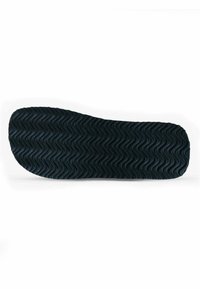 Black rubber shoe sole with a wavy texture, rounded toe, and flat edges. No visible logos or patterns.