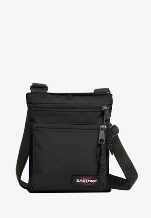 Bolso bandolera negro de Eastpak con dos compartimentos con cremallera y correa de hombro ajustable.