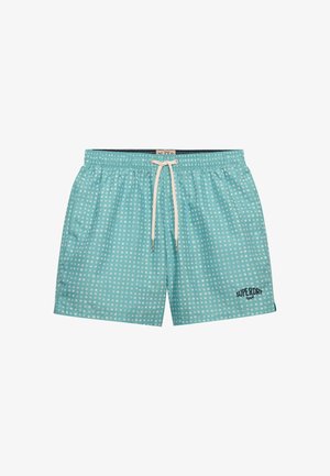 Jasnoniebieskie kąpielówki w białe kropki, z białym sznurkiem, bocznymi kieszeniami i logo "Superdry 1954" na lewej nodze.