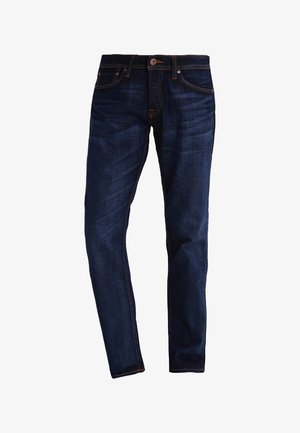 Temno modre kavbojke iz jeansa z ozkim krojem, oranžnimi šivi, petimi žepi ter z zapiranjem na gumb in zadrgo.