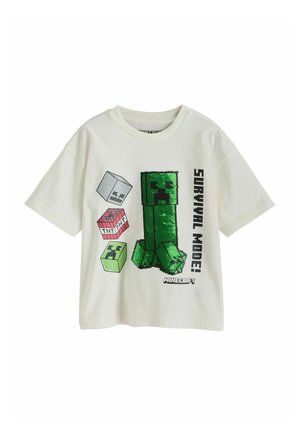 Hvid T-shirt med korte ærmer med Minecraft Creeper og blokke grafik, inklusive tekst "Survival Mode!" og "Minecraft" logo.