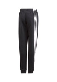 Pantalones de chándal negros hechos de tejido de mezcla de algodón, con franjas laterales blancas, cinturilla elástica y puños acanalados en los tobillos.