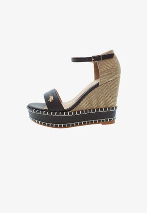 Wedge sandal featuring a brown leather strap, woven beige upper, and a thick black platform with white stitching and a logo accent.