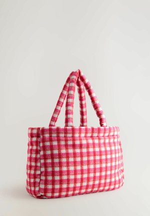 Tote bag cu un cadru roșu și alb în carouri, cu două mânere rezistente și o textură moale. Formă rotundă cu un vârf structurat.