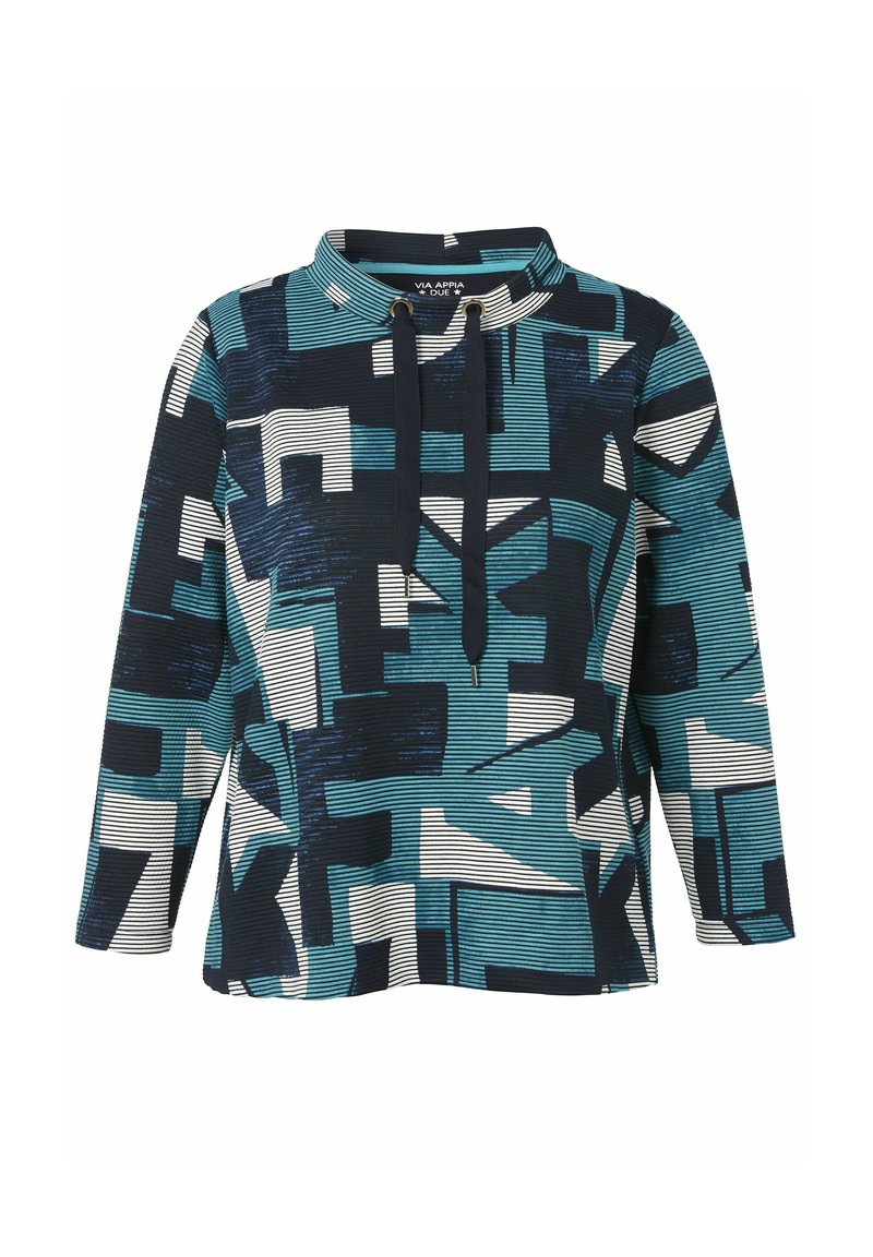 Langarmtrui met teal, marineblauw en witte geometrische patronen en een hoge kraag met zwarte trekkoorden.