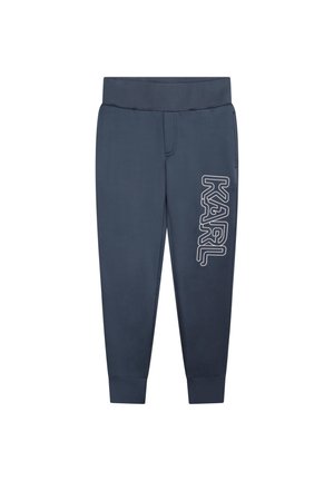 Pantalones jogger azul marino con cintura y puños elásticos, que presentan el logo en texto blanco "KARL" en la pierna derecha.