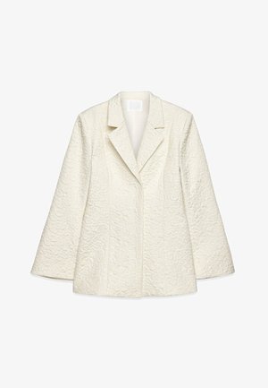 Weißer strukturierter Blazer mit Reverskragen, langen Ärmeln und floralem Muster. Hat eine taillierte Passform und glatte Fütterung.