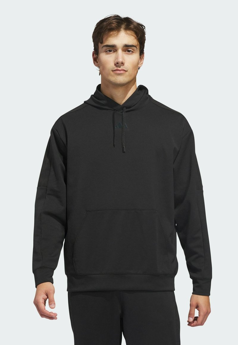 Black pullover hoodie made from soft fabric, featuring a front kangaroo pocket, adjustable drawstring hood, and minimalistic design accents.