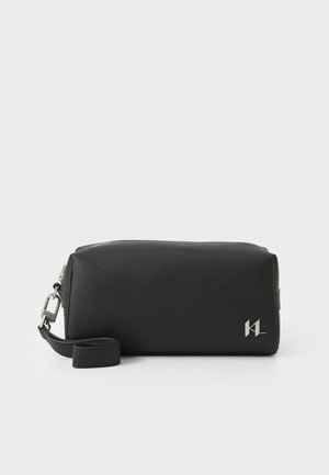 Black leather pouch with a rectangular shape, featuring a silver hardware accent and a detachable strap for flexible carrying options.